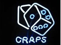 A neon sign that says craps with dice.