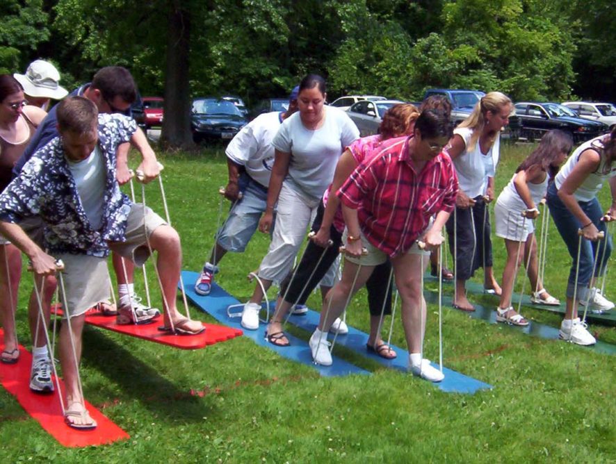 A group of people standing on the grass