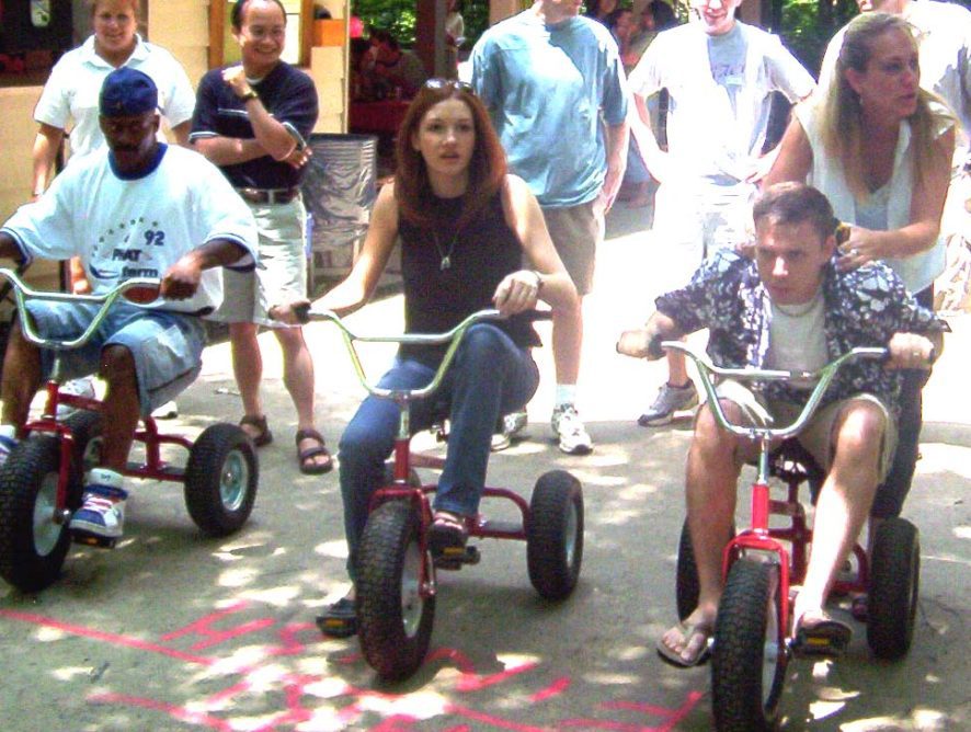 A group of people riding bikes on the street.