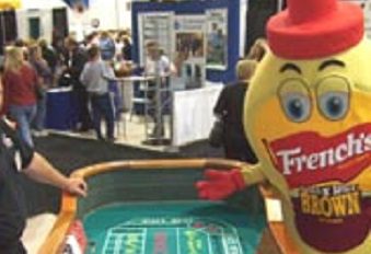 A person in a costume playing craps at an event.