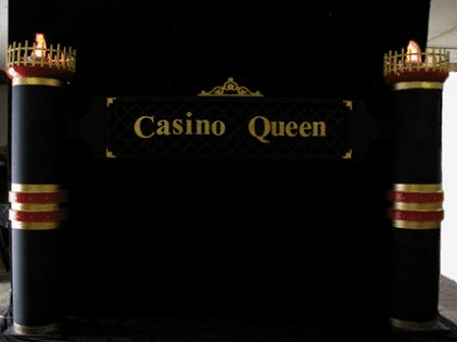 A sign that says casino queen in gold letters.